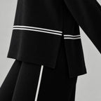 Women's black and white striped mock neck co-ord set with wide-leg trousers