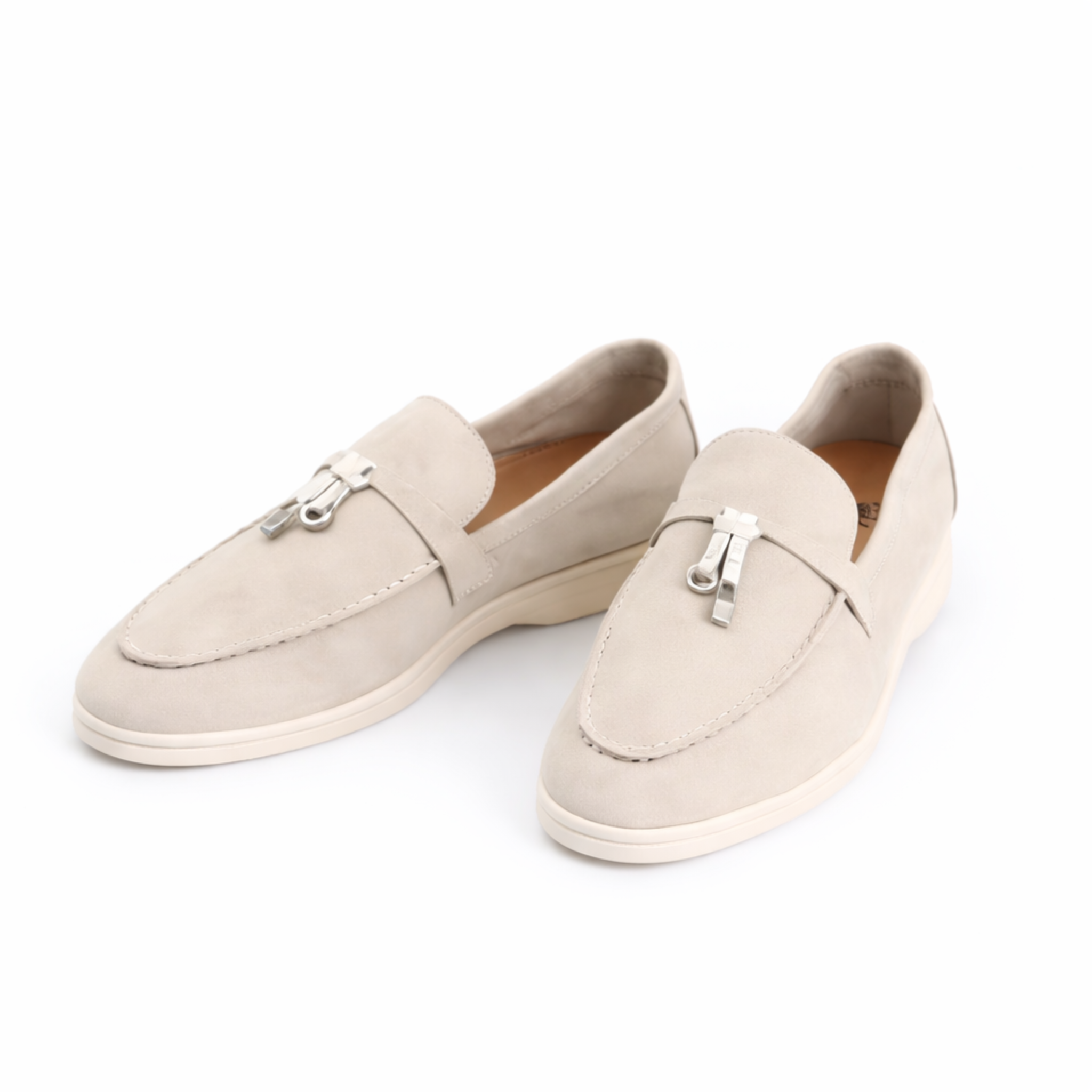 Women's classic slip-on loafer with rounded toe, flat sole and decorative metal trim