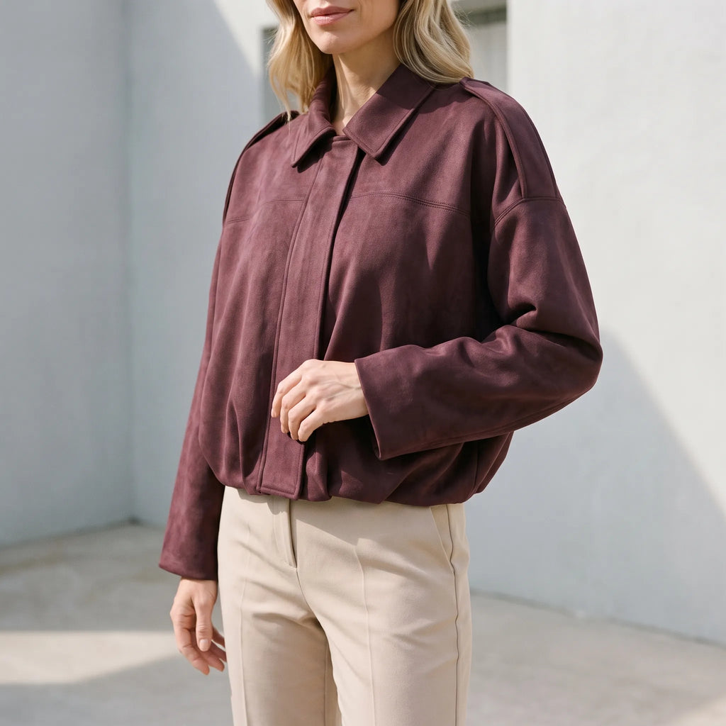 Women's oversized cropped collared jacket with long sleeves and zip front