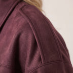 Women's oversized cropped collared jacket with long sleeves and zip front