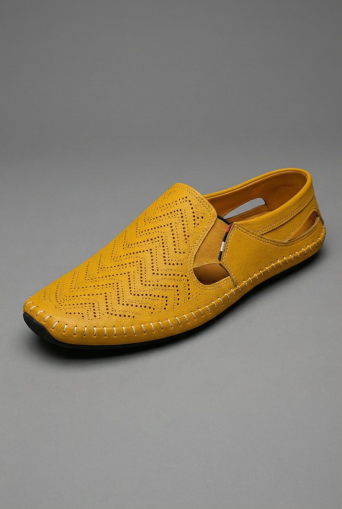 Men's perforated slip-on loafers with round toes and stitched soles