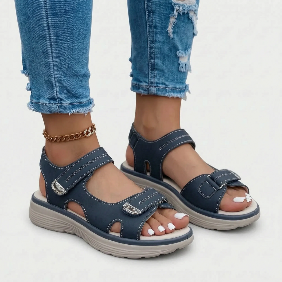 Women's black open-toe sandals with two adjustable buckled straps and raised textured soles