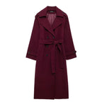 Women's burgundy long belted trench coat with double-breasted buttons and lapels