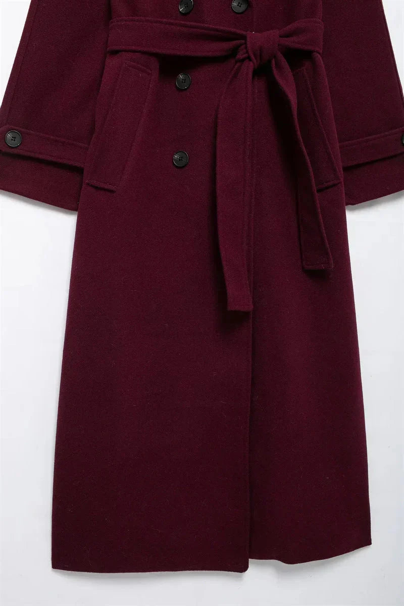 Women's burgundy long belted trench coat with double-breasted buttons and lapels