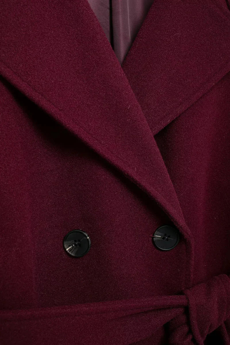 Women's burgundy long belted trench coat with double-breasted buttons and lapels