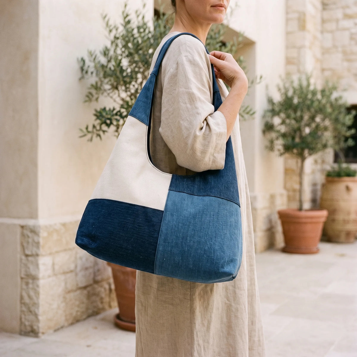 Women's geometric patchwork hobo shoulder bag with contrasting blue panels