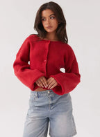 Women's red ribbed cropped cardigan with crew neckline and button front