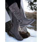 Brown women's mid-calf boots with ribbed cuffs, buckle straps and side zips