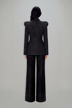 Women's charcoal fitted blazer with structured shoulders and peak lapels