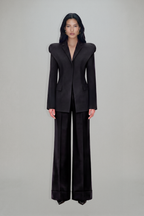 Women's charcoal fitted blazer with structured shoulders and peak lapels