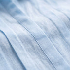 Women's short-sleeved pleated blouse with collared neckline and button front
