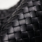 Oversized woven shoulder tote bag with a slouchy shape