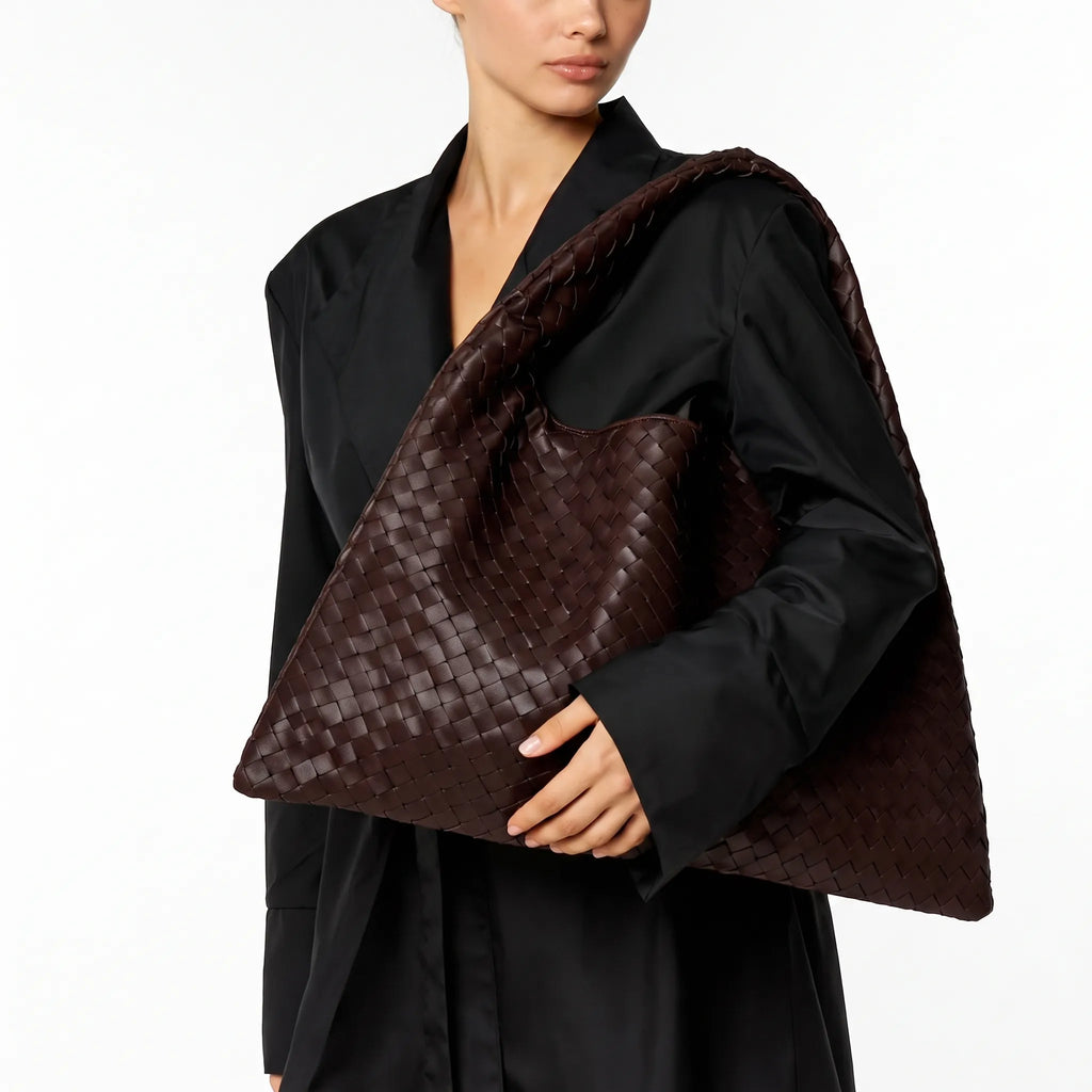 Oversized woven shoulder tote bag with a slouchy shape