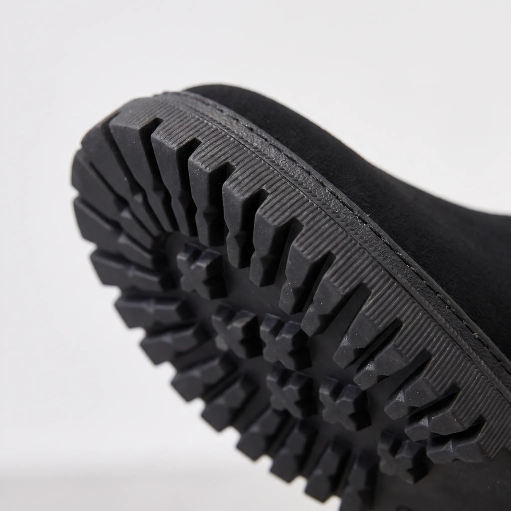 Lined chunky ankle boots with side zips, fur-like trim and lug soles shown in black and beige