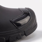Mid-calf Wellington boots with drawstring collars and lugged soles