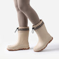 Mid-calf Wellington boots with drawstring collars and lugged soles