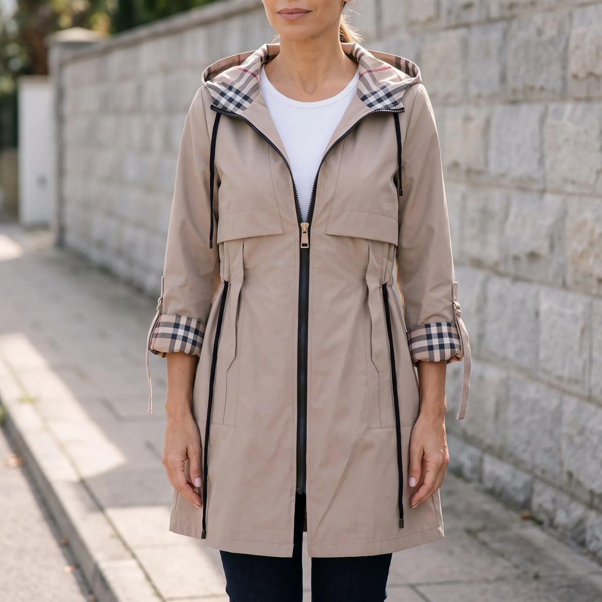 Women's longline hooded parka jacket with checked lining, zip front and utility pockets