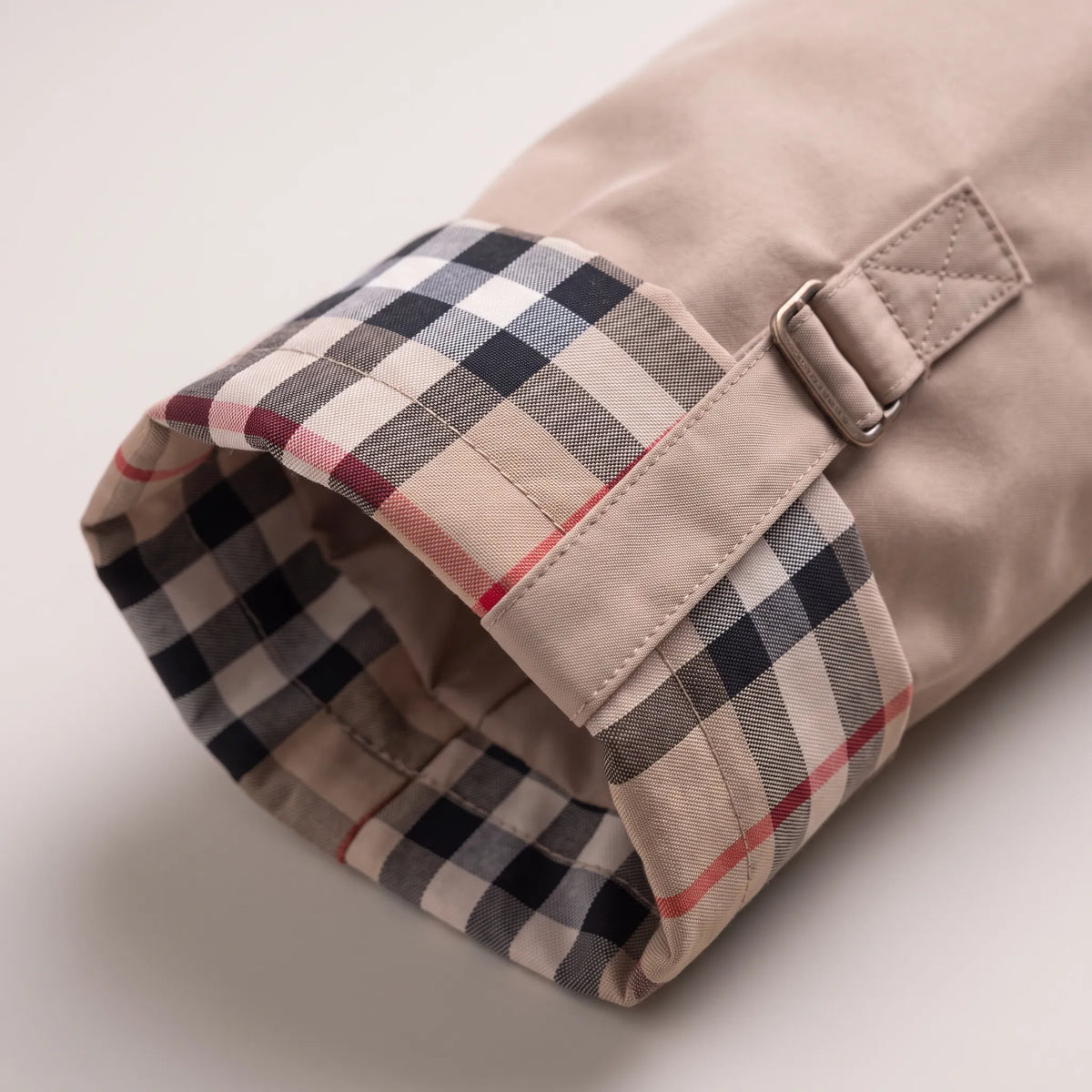Women's longline hooded parka jacket with checked lining, zip front and utility pockets