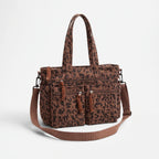 Women's ribbed leopard print tote bag with multiple front pockets and shoulder strap