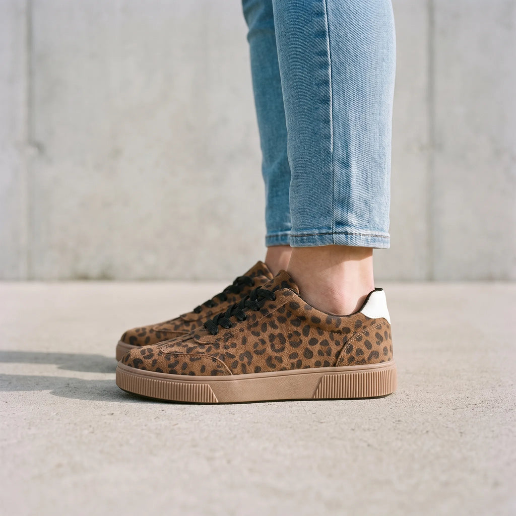 Women's low-top trainers with leopard print uppers, black laces and raised platform soles