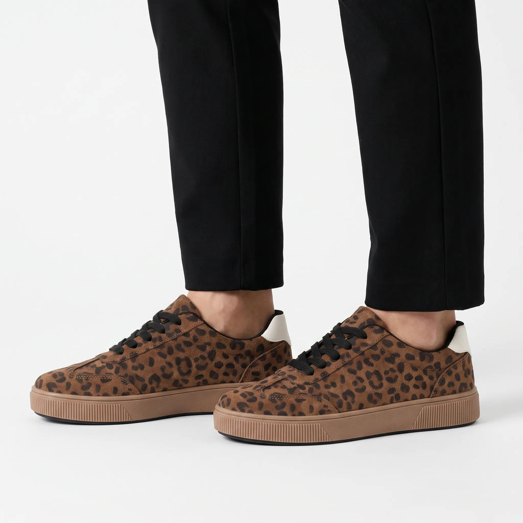 Women's low-top trainers with leopard print uppers, black laces and raised platform soles
