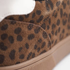 Women's low-top trainers with leopard print uppers, black laces and raised platform soles
