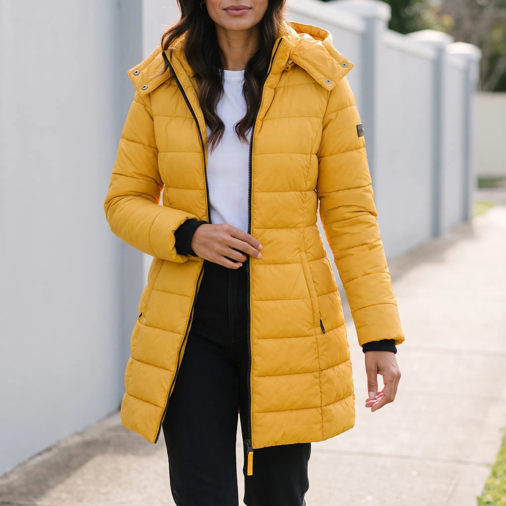 Women's longline quilted hooded puffer jacket with zip front and side pockets