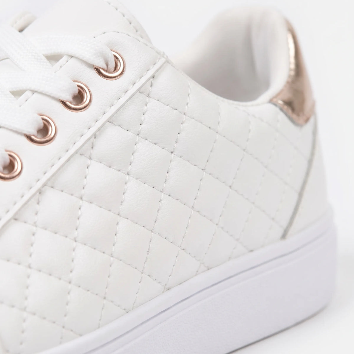 Women's quilted lace-up trainers with metallic heel detail