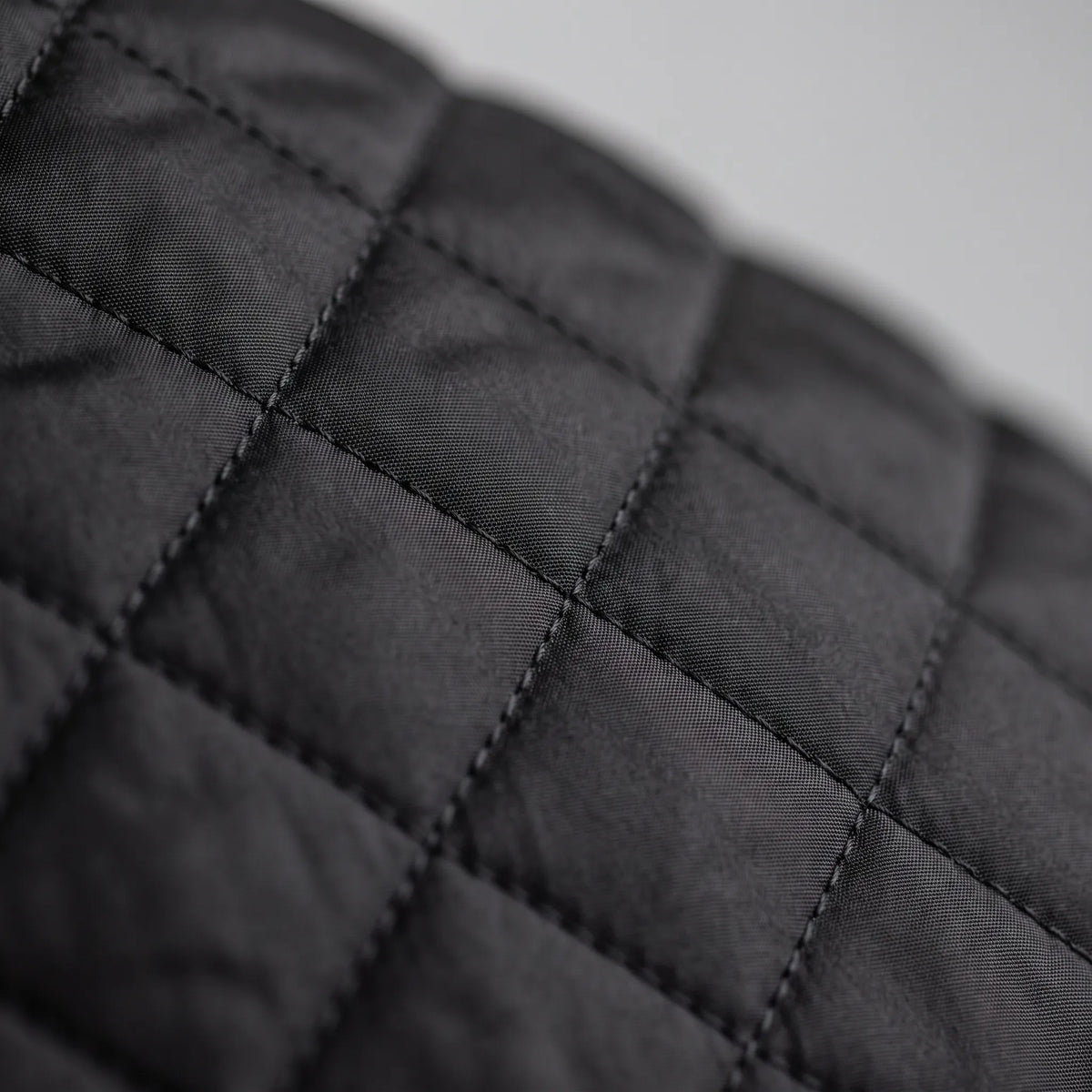 Men's diamond quilted padded jacket with stand collar and zip pockets