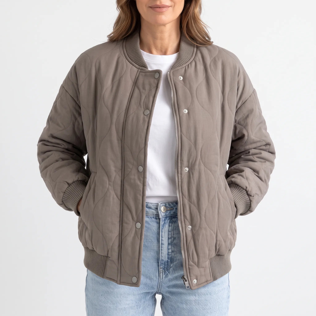 Women's oversized quilted bomber jacket with ribbed trim and front pockets