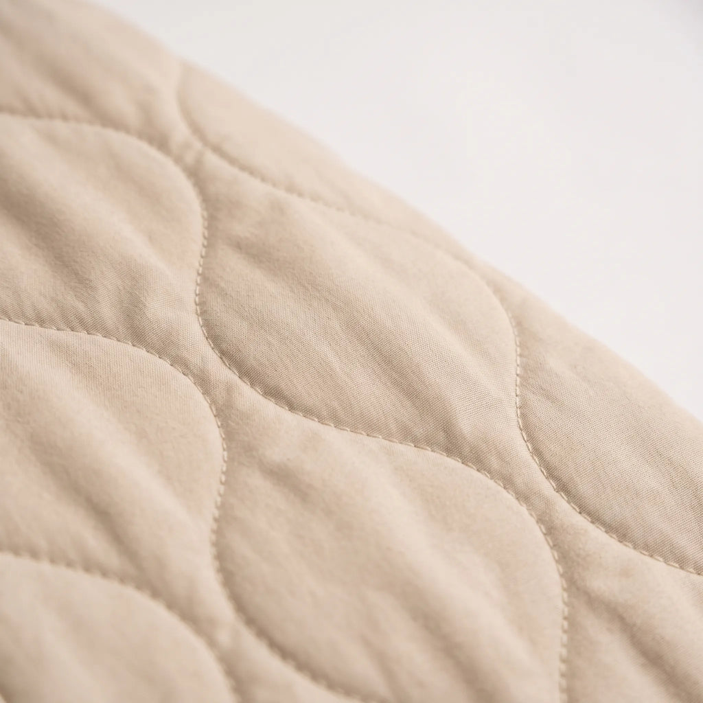 Women's oversized quilted bomber jacket with ribbed trim and front pockets