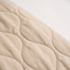 Women's oversized quilted bomber jacket with ribbed trim and front pockets