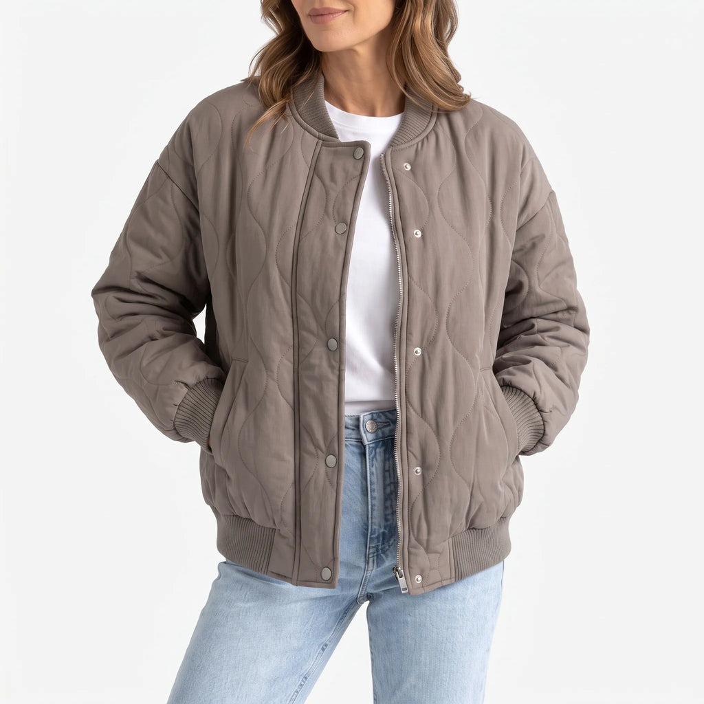 Women's oversized quilted bomber jacket with ribbed trim and front pockets