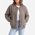 Women's oversized quilted bomber jacket with ribbed trim and front pockets