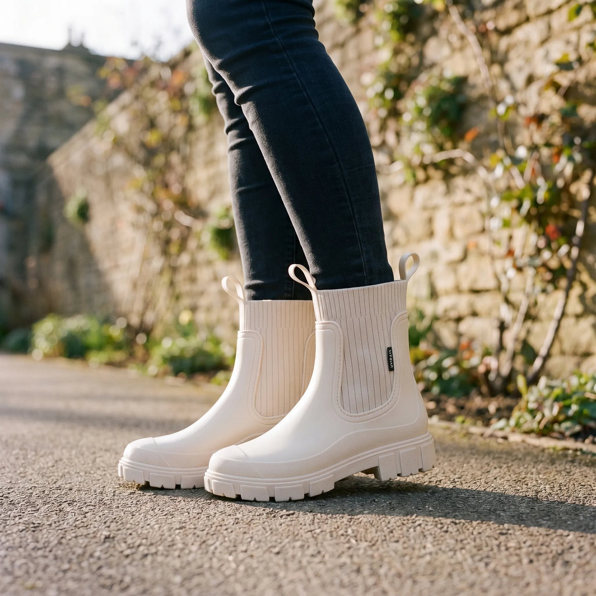 Women's ankle rain boots with ribbed shafts and chunky treaded soles