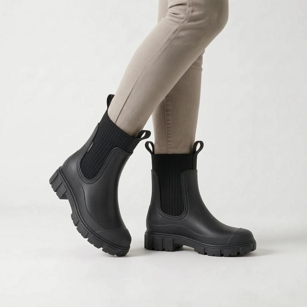 Women's ankle rain boots with ribbed shafts and chunky treaded soles