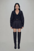 Women's black cropped blazer with V-neckline, long sleeves, embellishment and fringe trims