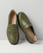 Women's slip-on loafers with penny straps, rounded toes and low heels