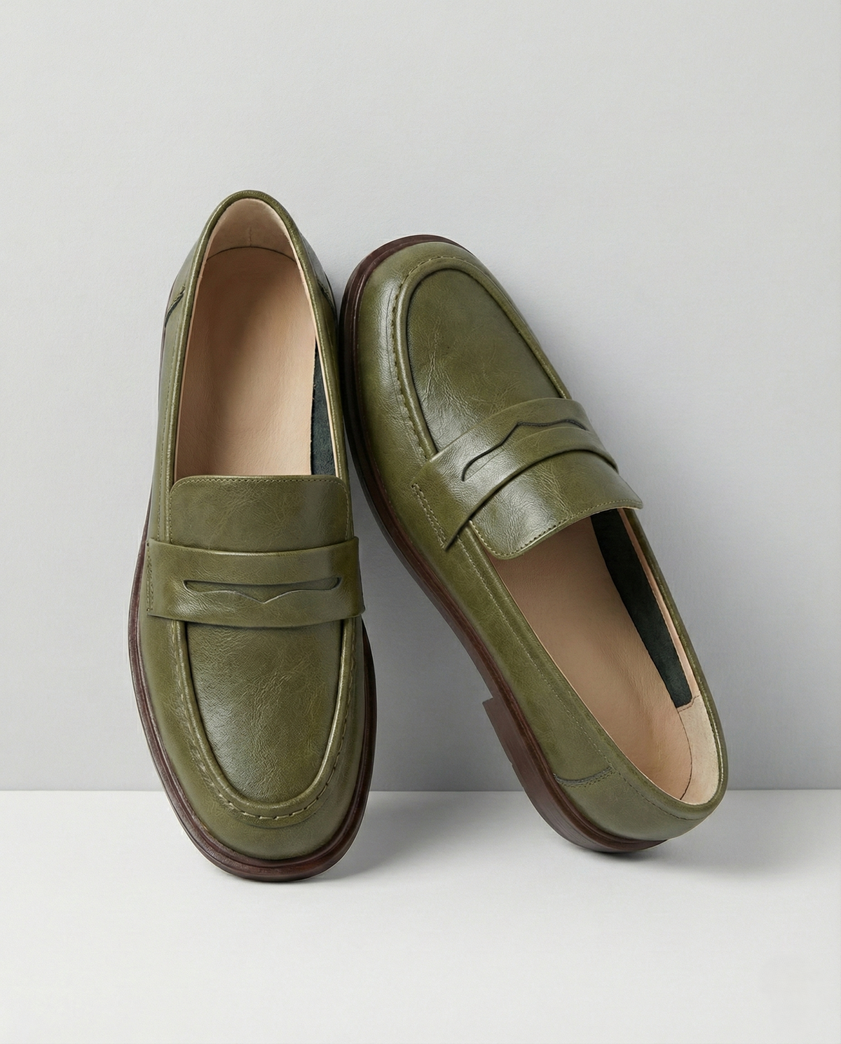 Women's slip-on loafers with penny straps, rounded toes and low heels