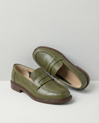Women's slip-on loafers with penny straps, rounded toes and low heels