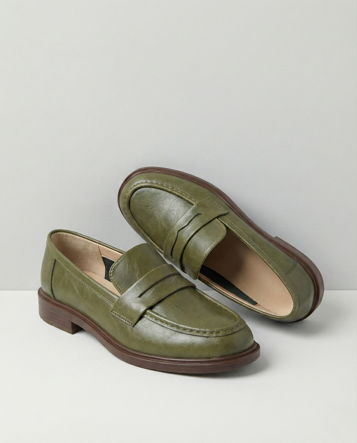 Women's slip-on loafers with penny straps, rounded toes and low heels