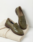 Women's slip-on loafers with penny straps, rounded toes and low heels