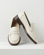 Women's slip-on loafers with penny straps, rounded toes and low heels