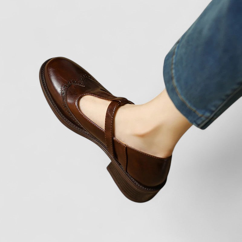 Women's Mary Jane shoes with buckle straps, perforated toe detailing and low block heels