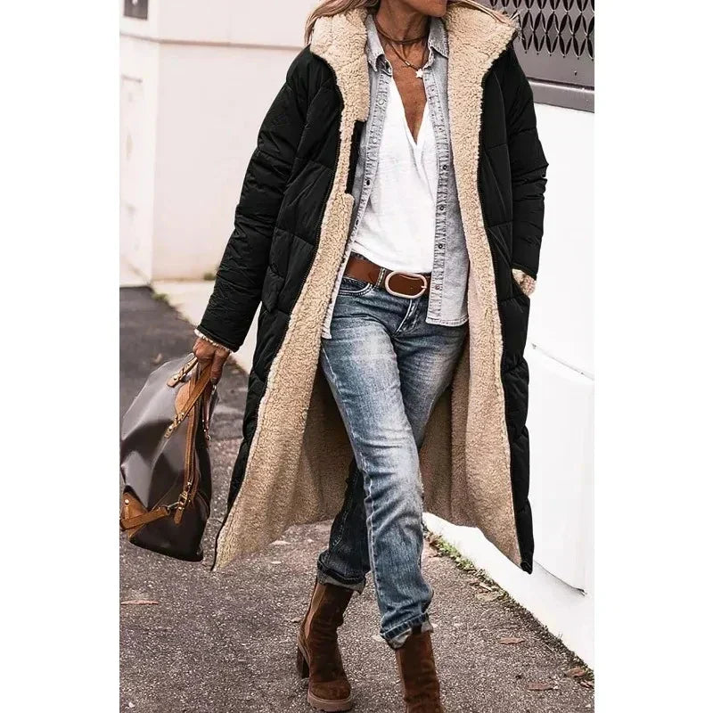 Women's long quilted hooded coat with contrasting textured trim and side pockets