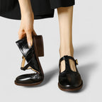 Women's Mary Jane shoes with buckle straps, perforated toe detailing and low block heels