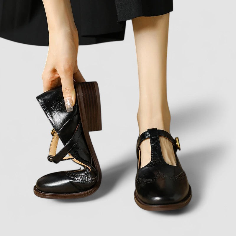 Women's Mary Jane shoes with buckle straps, perforated toe detailing and low block heels