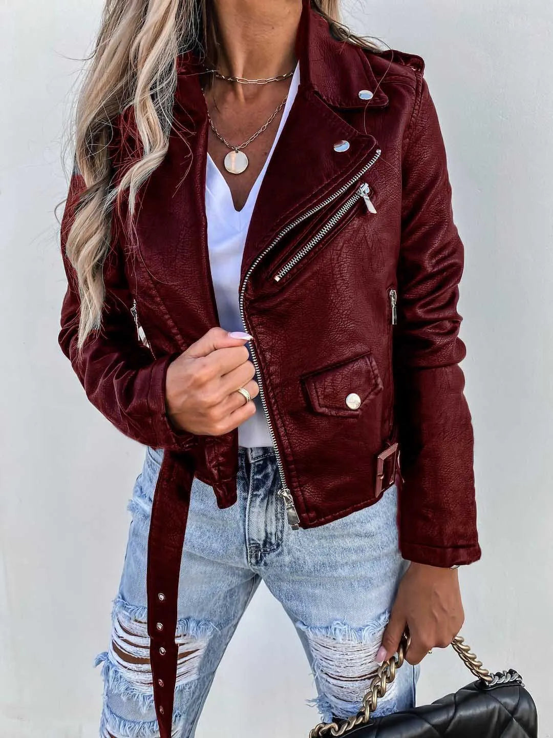 Women's textured biker jacket with asymmetric zip, notched collar and buckled waist belt