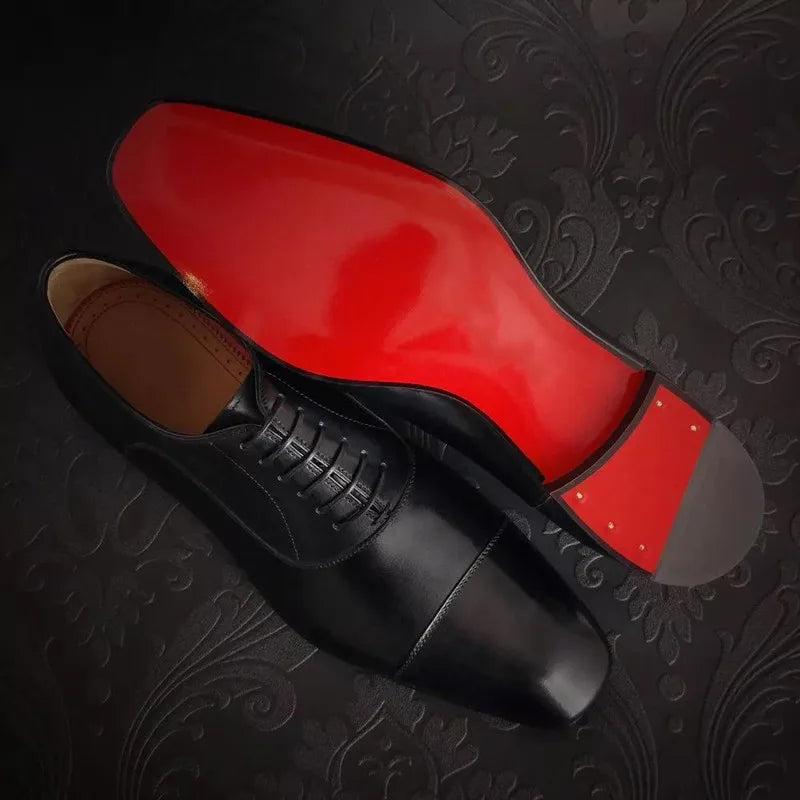 Men's cap toe Oxford shoes with lace-up fronts and contrasting soles