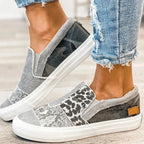 Women's patterned slip-on loafers with animal-print panels and flat white soles